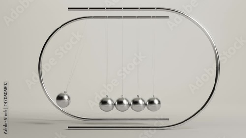 A seamless looping animation of a newtons cradle balancing balls desk ornament mechanism swinging to and fro on an isolated studio background