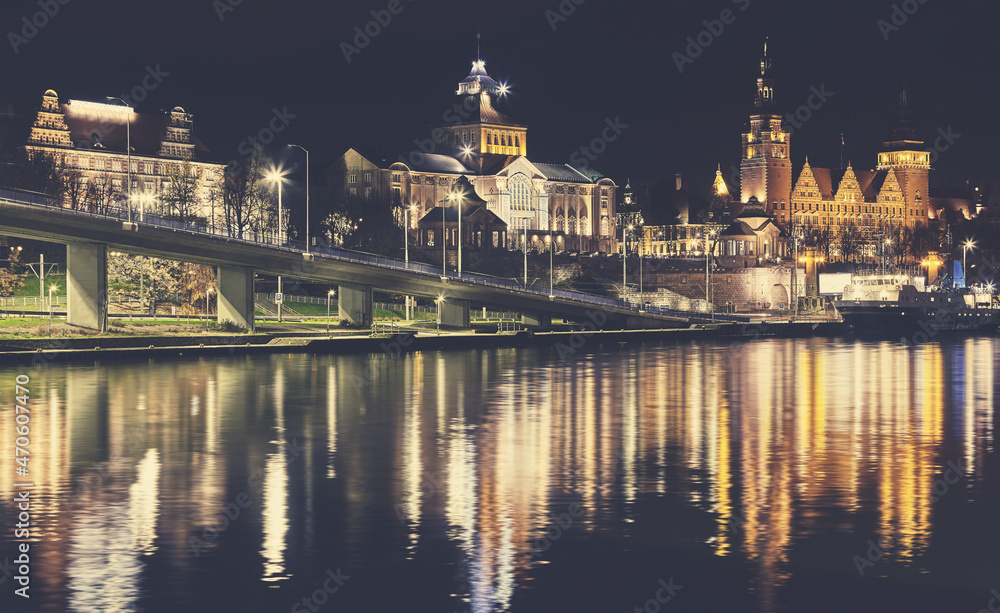 Szczecin waterfront with Chrobry Embankment at night, color toning applied, Poland.