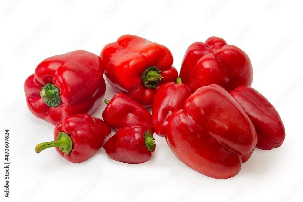Heap of red bell peppers different size on white background Heap of red bell peppers different size on white background
