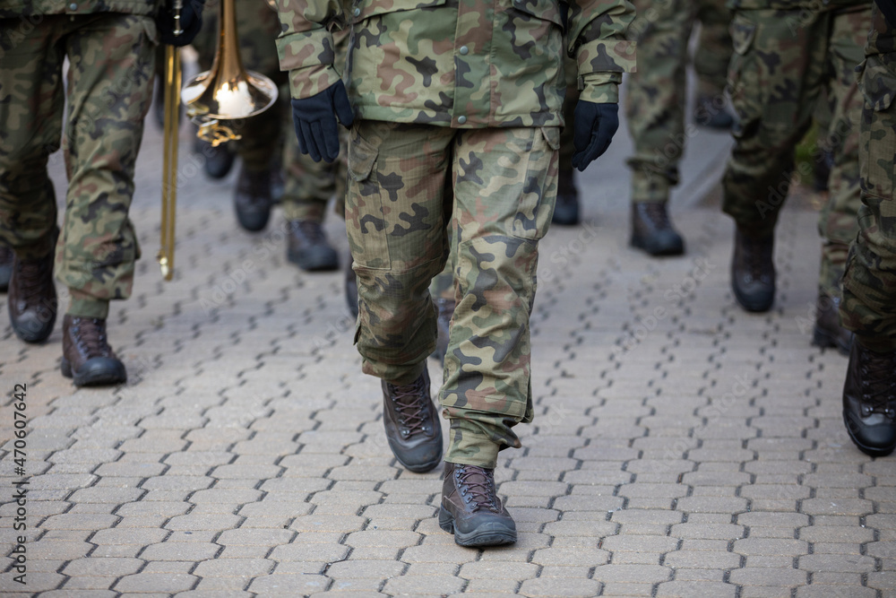 Soldiers on parade march with brass instruments. Soldiers on parade march with brass instruments.