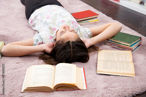 Girl realxed in her romm, without books