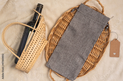 Flat lay mockup gray wine bag and wine bottle. New Years Eve Mock up photo