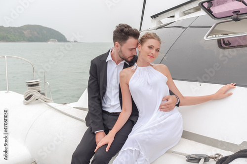 Portrait caucasian couple in love on luxury white yacht in ocean © u photostock
