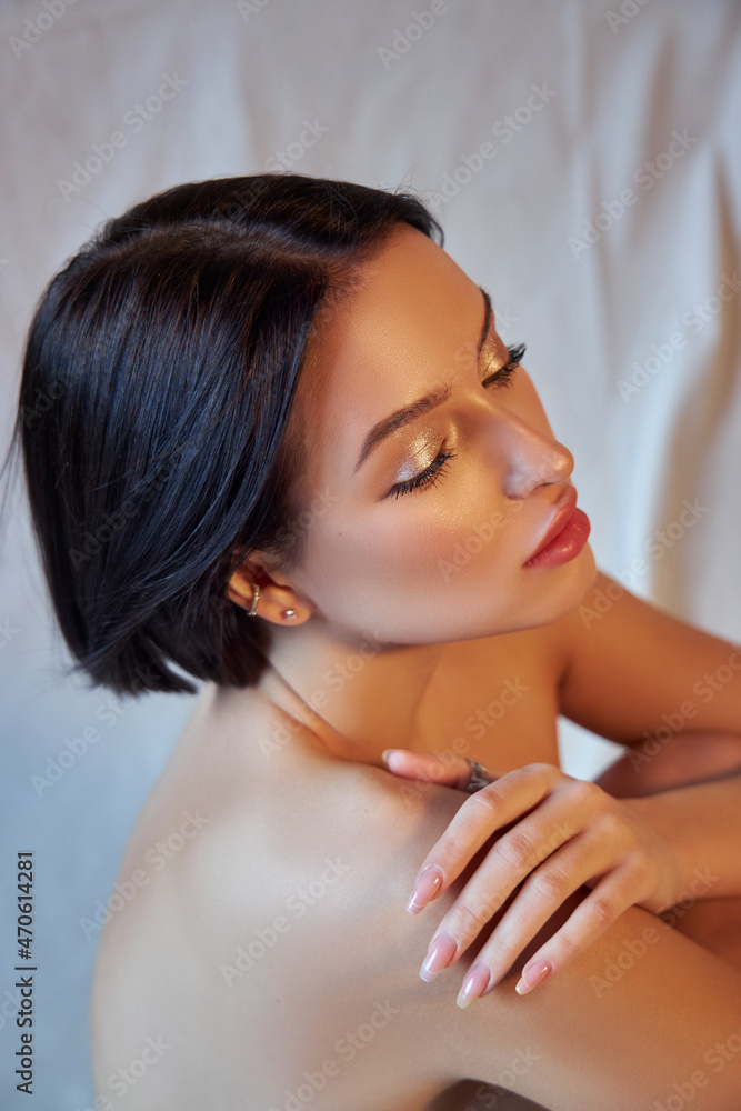 Fototapeta premium Portrait nude beauty woman short hair fashion coloring. Dark hair coloring, short haircut chocolate color. Art Beautiful woman clean facial skin, natural makeup, strong hair