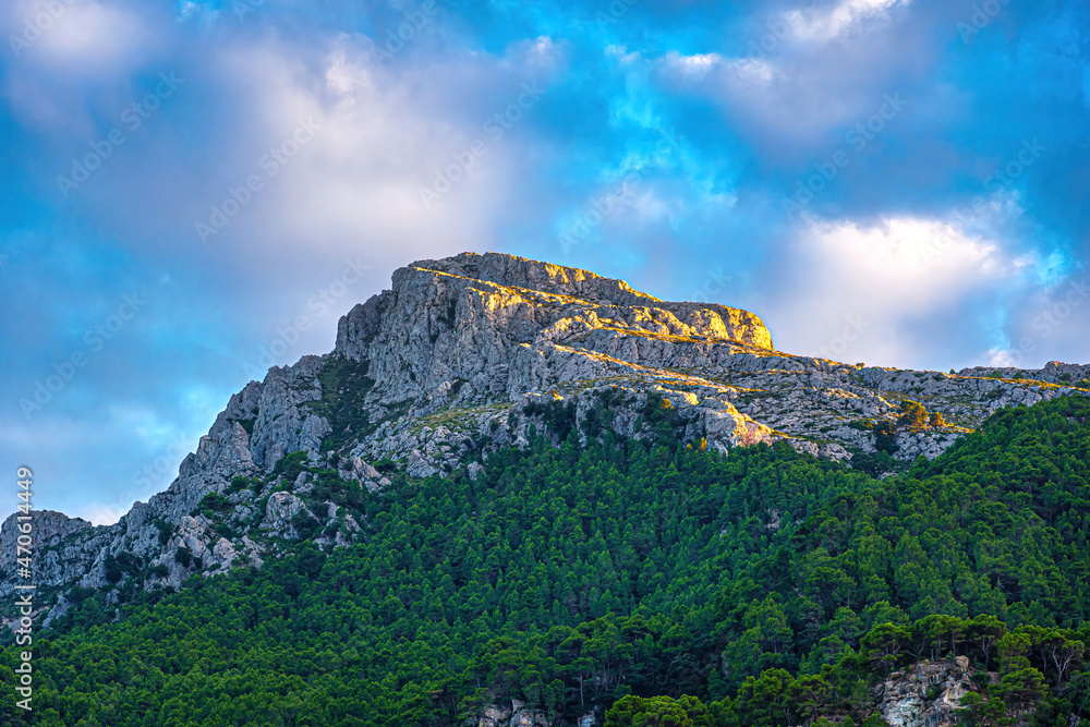 mountain with blue sky and qhirw clouds. view of mallorca sierra de tramuntana.