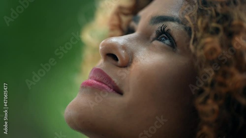 Brazilian person close-up face looking at sky with HOPE photo