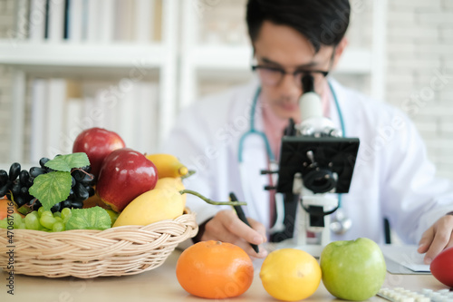 asia nutritionist man research food in laboratory