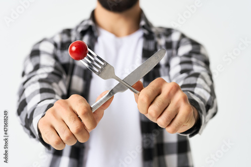 emotional bearded man in plaid shirt plate with salad