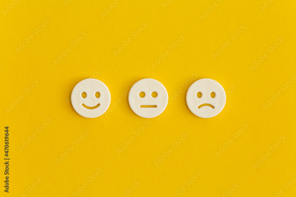 Emoticon smile on a yellow background. Customer feedback.