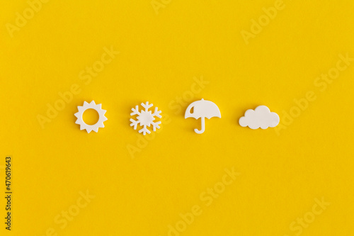 Weather icons set on yellow background. Weather forecast concept. photo