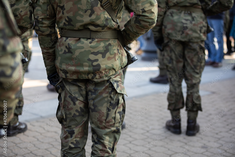 Rear view of soldiers standing in several ranks with weapons. Rear view of soldiers standing in several ranks with weapons.