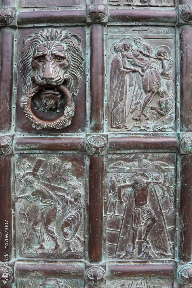Fragment of bronze door of Archangelo-Mikhailovsky Zverinetsky cave monastery in Kyiv, Ukraine
