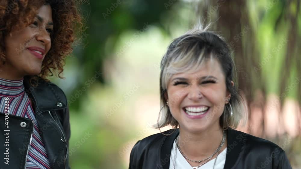 Diverse woman together laughing and smiling, authentic real life people smile and laugh Diverse woman together laughing and smiling, authentic real life people smile and laugh
