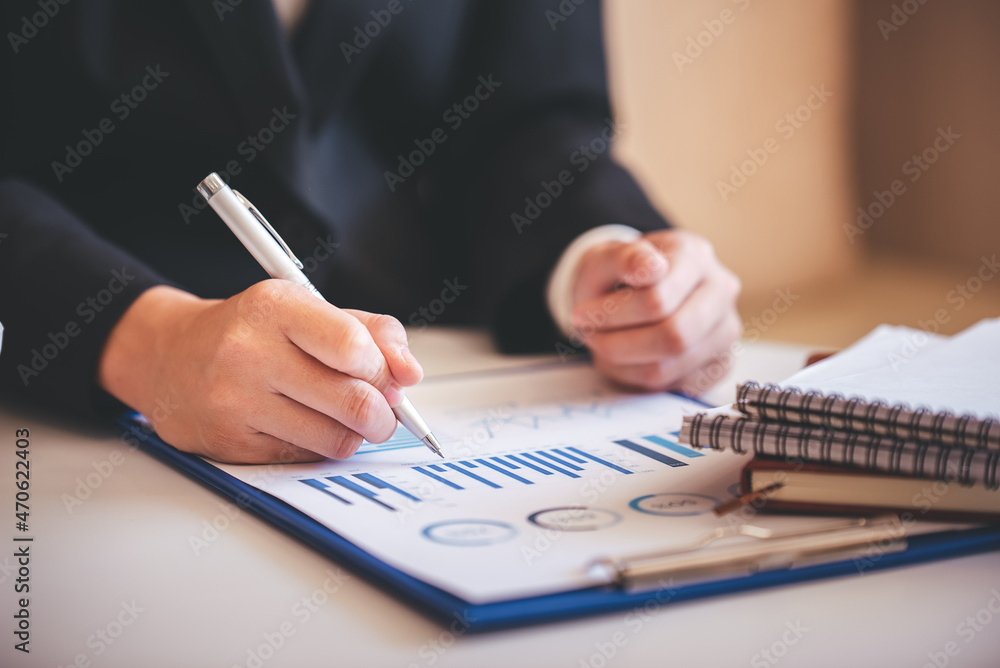 business woman work in the business office on the desk business woman work in the business office on the desk