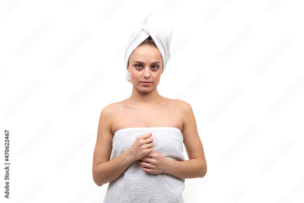 middle-aged woman on a white background after a shower middle-aged woman on a white background after a shower