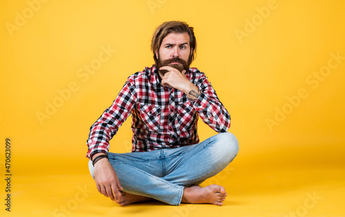 guy with long lush beard and mustache on face. handsome confident man has perfect hairstyle. happy bearded man in checkered shirt. male beauty concept. Portrait of bearded hipster. Hair care concept © be free
