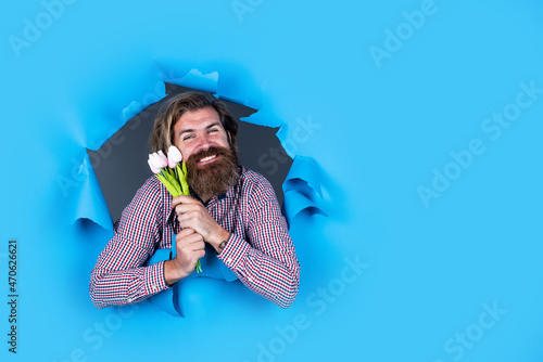 be my valentine. spring tulip flowers. feel the surprise. happy mothers day. celebration of holiday. cheerful bearded man hold bouquet present. gift with love. happy valentines day. copy space