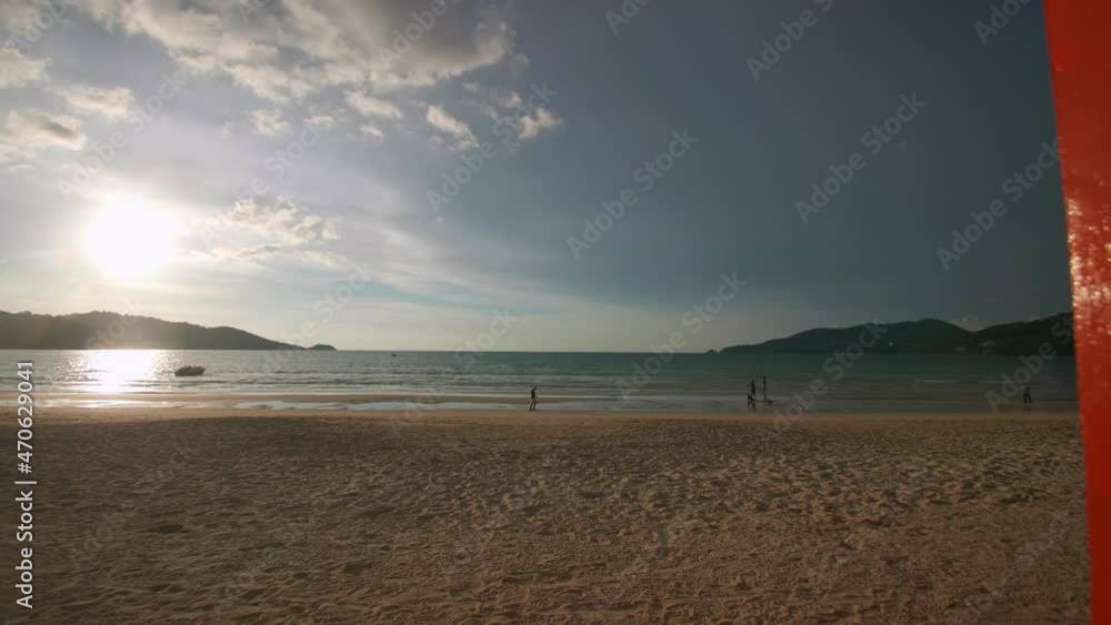 Phuket sign multi color on beach at Patong beach , Phuket Thailand. The beach with PHUKET sign and tourists on the beach Phuket sign multi color on beach at Patong beach , Phuket Thailand. The beach with PHUKET sign and tourists on the beach