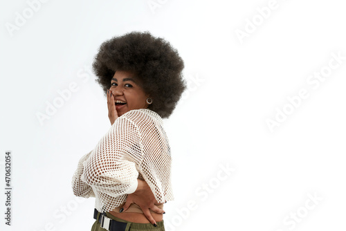 Confused black woman covering her mouth with hand