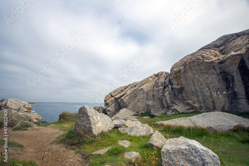 Dalkey cliffs and rocks seashore in sunny day, rocks on the seashore, Dublin county, Ireland 