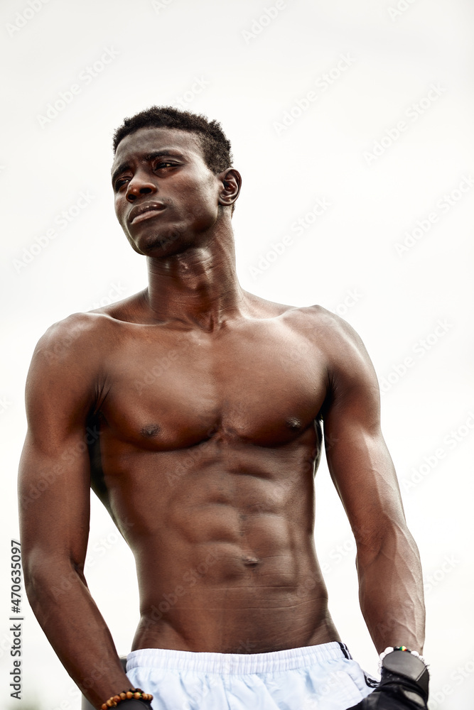 Portrait of topless Afro-American sportsman ready to training. Portrait of topless Afro-American sportsman ready to training.