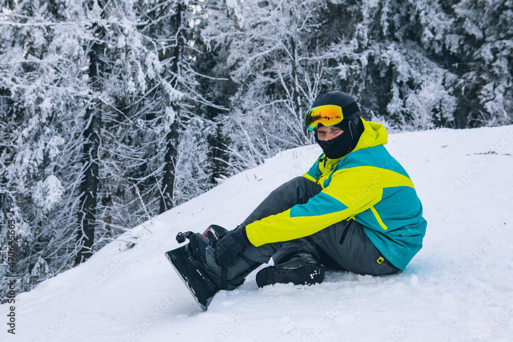 man strap in snowboard. winter sport activities