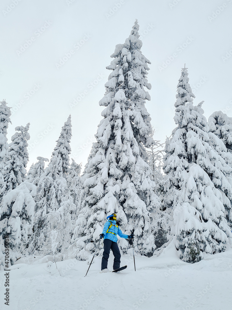 smiling woman skier at powder day