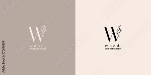Delicate, natural logos - the letter "W" and a branch of a plant with leaves. Linear illustration, for womens business. Logo for a wood accessories store. Health and beauty. Salon name - Wood