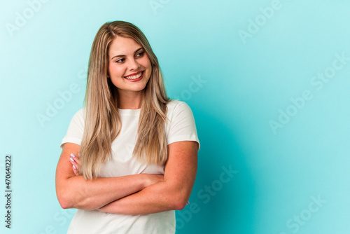 Young russian woman isolated on blue background