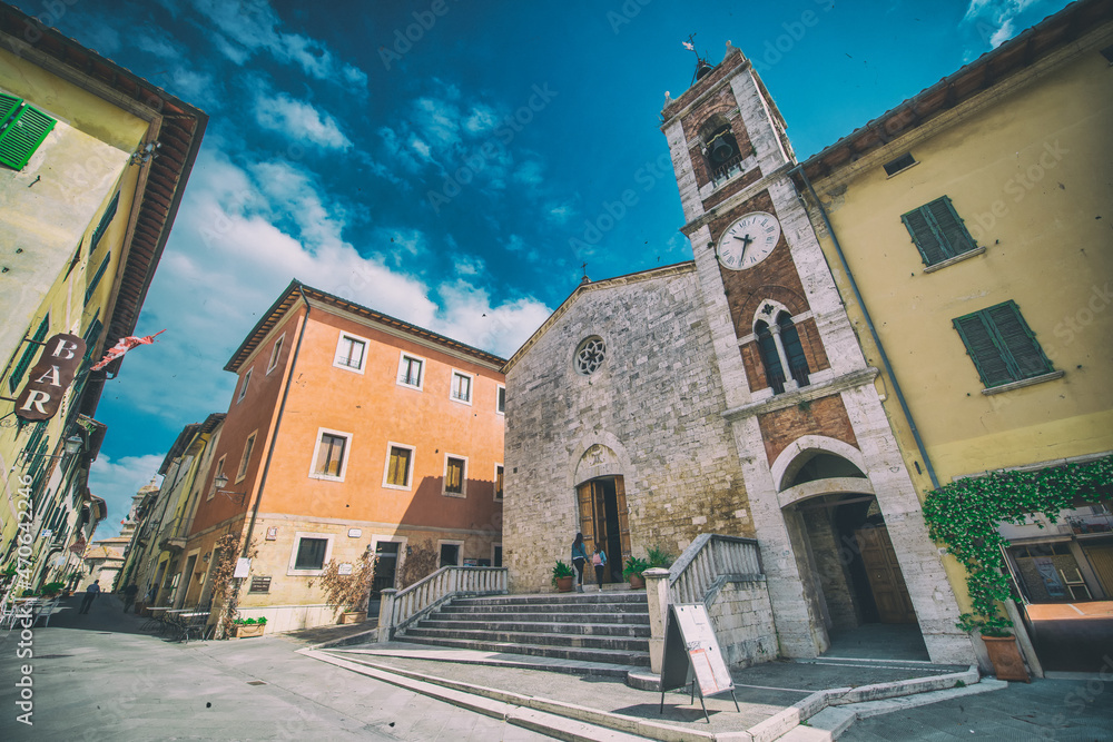 SAN QUIRICO, ITALY - MAY 31, 2020: View of the central square on a beautiful spring morning.