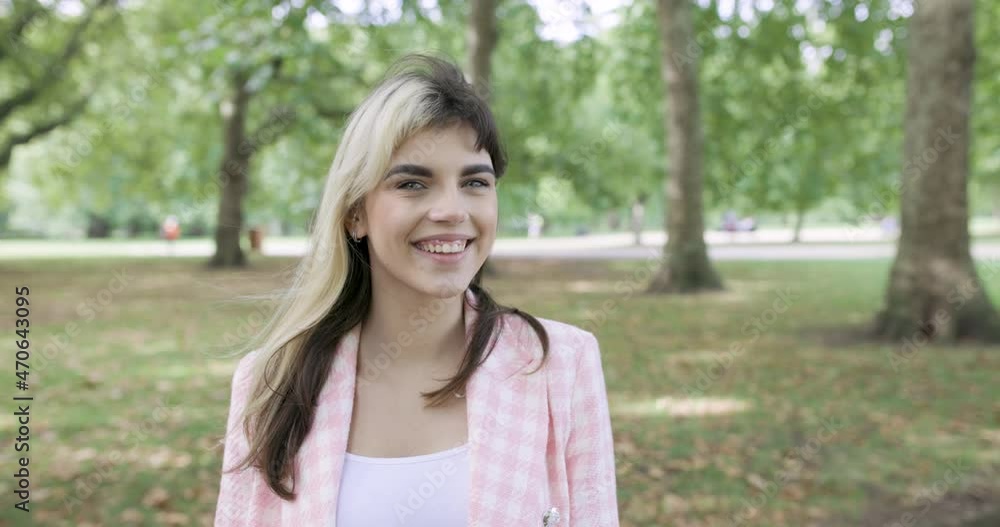 Portrait of smiling woman in public park Portrait of smiling woman in public park