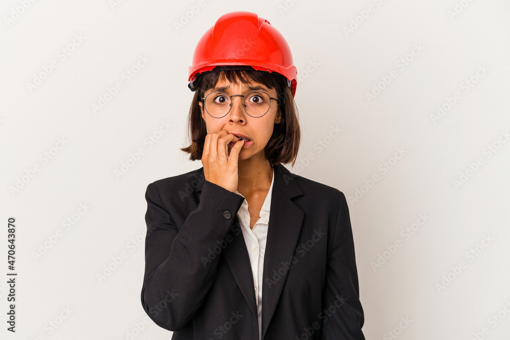 Young architect woman with red helmet isolated on white background biting fingernails, nervous and very anxious. Young architect woman with red helmet isolated on white background biting fingernails, nervous and very anxious.