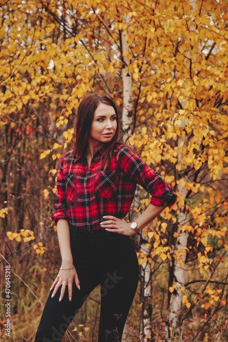 Portrait of cute young woman in casual wear in autumn