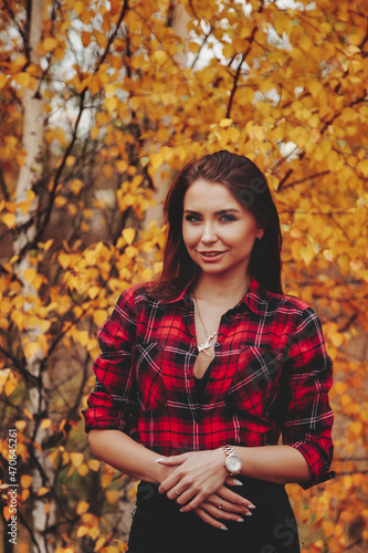 Portrait of cute young woman in casual wear in autumn