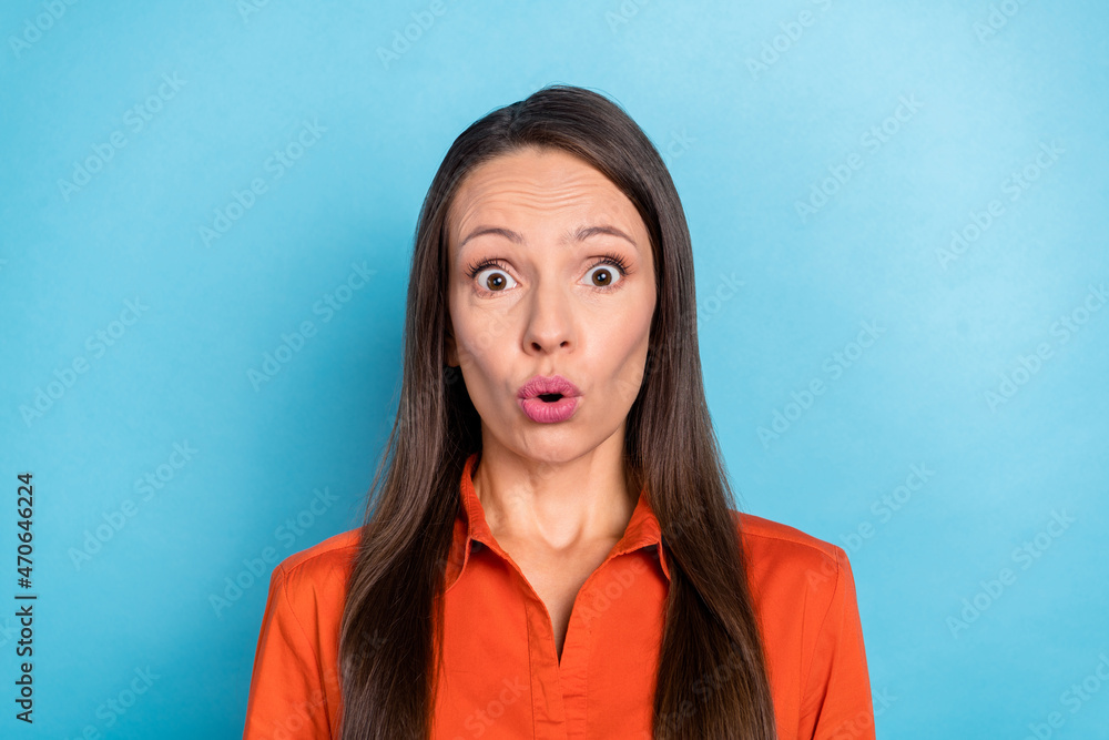Fototapeta premium Photo of impressed funny young woman wear red shirt big eyes isolated blue color background