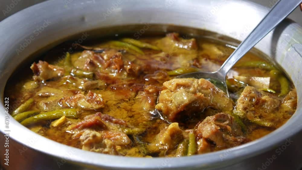 traditional Indian curry lamb masala in a bowl on table traditional Indian curry lamb masala in a bowl on table