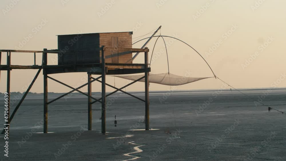 Fisherman's cabin hut carrelet during dusk in Baie de Bourgneuf, France Fisherman's cabin hut carrelet during dusk in Baie de Bourgneuf, France