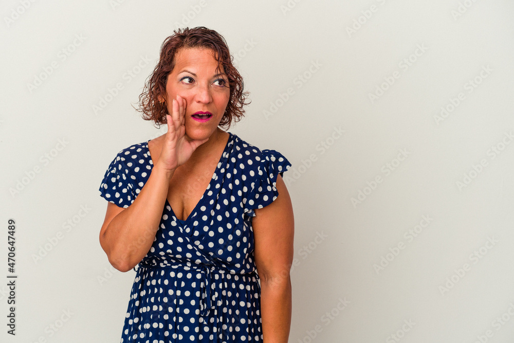 Middle age latin woman isolated on white background is saying a secret hot braking news and looking aside Middle age latin woman isolated on white background is saying a secret hot braking news and looking aside