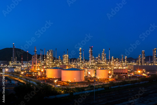 Aerial view. Oil refinery factory and oil storage tank at twilight and night. Petrochemical Industrial. © Sunday Stock
