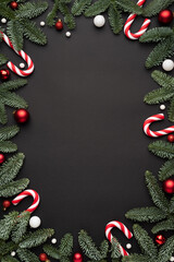 Black Christmas background with frame of Christmas ornaments
