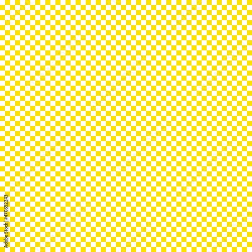Checkerboard with very small squares. Yellow and White colors of checkerboard. Chessboard, checkerboard texture. Squares pattern. Background.
