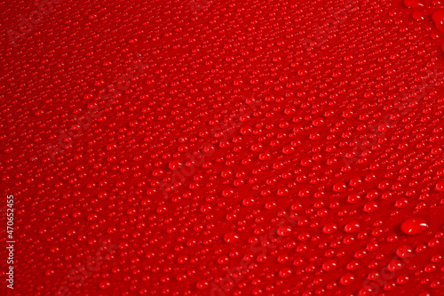 Abstract background, water droplets on red