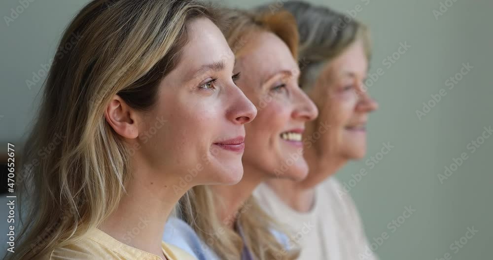 Close up portrait 3 female generations dynasty stand in row smile look away then turn to camera. Profile view of happy healthy young aged and elderly women faces. Ageing process. Genetics and heredity Close up portrait 3 female generations dynasty stand in row smile look away then turn to camera. Profile view of happy healthy young aged and elderly women faces. Ageing process. Genetics and heredity
