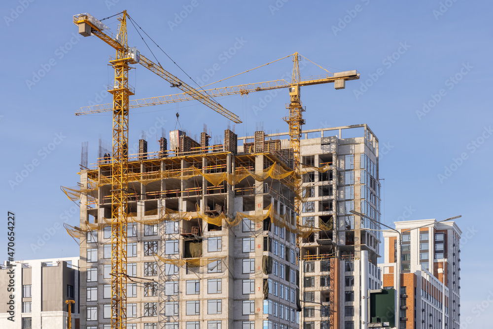 Construction site with cranes and buildings. Nur-Sultan, Kazakhstan.