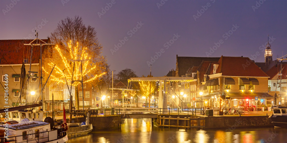 View with christmas decoration of the harbor in the Dutch ancient city center of Hoorn, The Netherlands