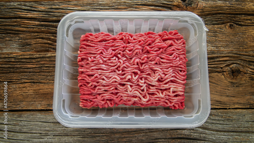 Ground beef in plastick try on table Ground beef in plastick try on table