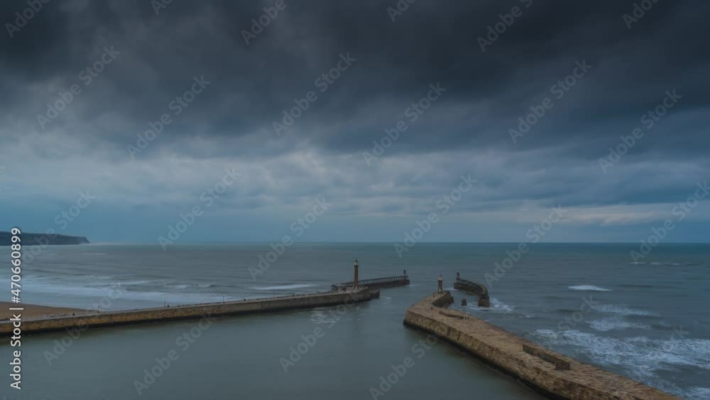 Whitby TownshipTime Lapse, Yorkshire Late afternoon Misty Sunset Light Fog Harbor Harbour Abbey and Lighthouse Pier Whitby TownshipTime Lapse, Yorkshire Late afternoon Misty Sunset Light Fog Harbor Harbour Abbey and Lighthouse Pier