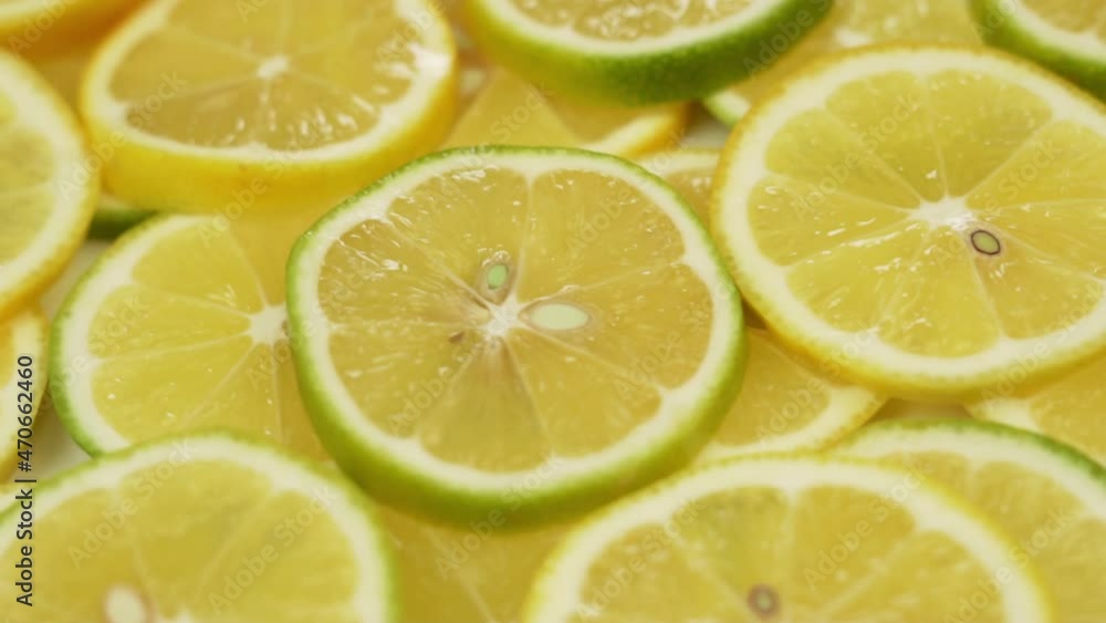 Juicy Lemon Slices, Macro. Sliced Lemon Lime Pieces Rotate. Citrus Fruits, Isolated. Background from Lemons Limes Lolek, Halves. Healthy Vegan Food and Vitamin C for the Immune System. Juicy Lemon Slices, Macro. Sliced Lemon Lime Pieces Rotate. Citrus Fruits, Isolated. Background from Lemons Limes Lolek, Halves. Healthy Vegan Food and Vitamin C for the Immune System.