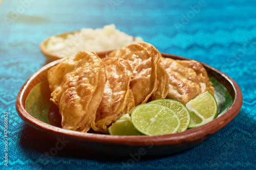 Traditional barbacoa tacos on wooden table. Mexican gastronomy concept. photo