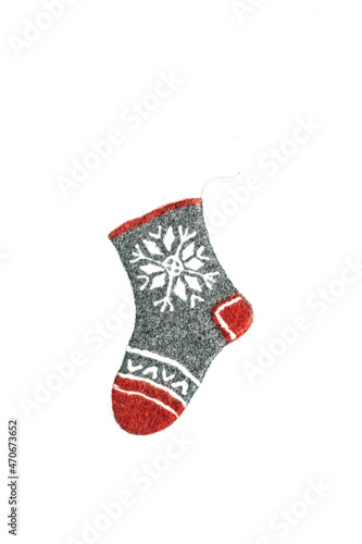 Craft felt Christmas sock isolated on white background. Cozy aesthetic Christmas ornament